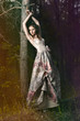 Portrait of romantic woman in fairy forest