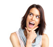 Excited young woman looking surprised against white