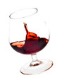 A red wine glass about to fall
