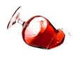 Red wine spilling from a transparent glass