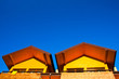 Part of yellow house under the blue sky