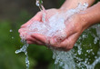 Woman's hands with water splash