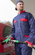 Gas Station Worker Refilling Car at Service Station