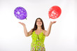 Pregnant woman playing with balloons