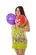 Pregnant woman playing with balloons