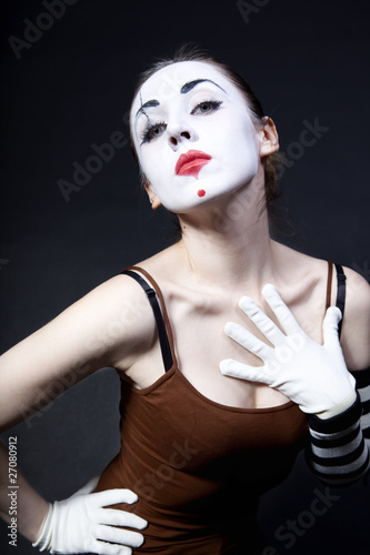 Photo: woman mime with theatrical makeup woman mime with theatrical makeup