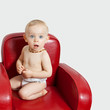 Baby girl on an armchair.bis