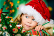 Happy small girl in santa hat have a christmas Happy small girl in santa hat have a christmas
