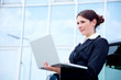 business woman outside with notebook