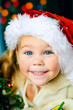 Photo: smiling child in Santa's hat have a Christmas smiling child in Santa's hat have a Christmas