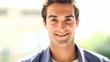 Handsome young man smiling and looking at you
