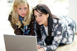 Teenage Girls Using Laptop Computer. Model Released