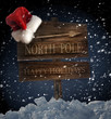 Photo en ligne au meilleur prix Wooden sign with Santa hat on snowy background