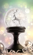 Snowglobe with ornaments against colored background