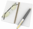 notebook with glasses and pen