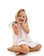 Little surprised angel sitting