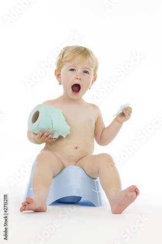 Photo: Infant on chamber pot. Infant on chamber pot.
