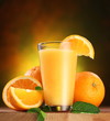 Oranges and glass of juice.