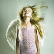 Beautiful happy girl with angel wings