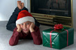Eight year old boy in santa hat