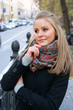Portrait of young woman in the city street