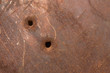 Rusty panel with bullet holes Rusty panel with bullet holes