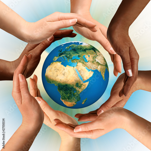 Photo: Multiracial Hands Surrounding the Earth Globe Multiracial Hands Surrounding the Earth Globe