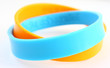 Yellow and light blue rubber bracelet.