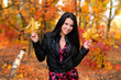 The girl brunette in autumn wood