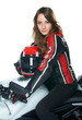 Photo: Sexy woman in a leather suit on motorcycle holding a helmet Sexy woman in a leather suit on motorcycle holding a helmet
