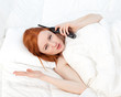 speaking on the phone woman in white bedding speaking on the phone woman in white bedding