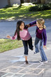 Photo: Girls playing hopscotch Girls playing hopscotch