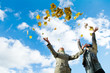 Two girls and Autumn leaves over blue sky Two girls and Autumn leaves over blue sky