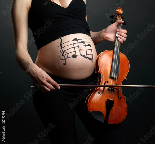 Photo: Pregnant woman with violin Pregnant woman with violin
