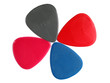 Closeup of 4 colorful plectrums isolated on white #4