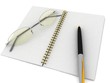 notebook with glasses and pen