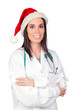 Attractive doctor woman with Christmas cup