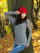 Beautiful woman spending time in park during autumn season