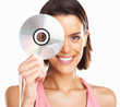 Beautiful woman on white background holding CD against white