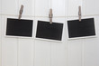 3 Fotos (quer) vor weißer Holzwand