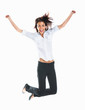 Casual woman jumping in joy isolated over white