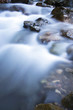 Autumn waterfall,stream and rocks on river