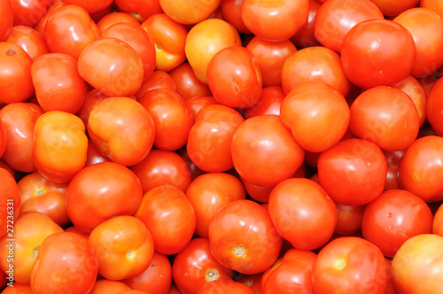 Photo: Background Of Red Tomatoes On Display Background Of Red Tomatoes On Display
