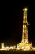 Oil derrick at night on Oklahoma plains