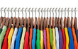 Multicolored clothes on wooden hangers Multicolored clothes on wooden hangers