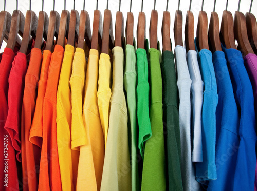 Photo: Colors of rainbow, clothes on wooden hangers Colors of rainbow, clothes on wooden hangers