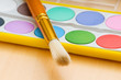 Art concept with painters palette and paint brush