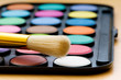 Art concept with painters palette and paint brush