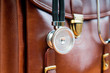 Doctor's case with stethoscope against wooden background