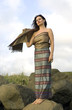 woman in national Thai clothes costs on a rock woman in national Thai clothes costs on a rock